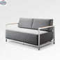 Enclover Acacia Lux loveseat with Sunbrella cushions, showcasing its stylish design and comfortable seating arrangement.