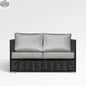 Chestnut loveseat by Enclover with Sunbrella® cushions, featuring a cozy, cushioned seating area and stylish fabric upholstery.