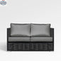 Chestnut Loveseat by Enclover with Sunbrella® cushions, featuring a sturdy frame and plush seating in a cozy, inviting design.