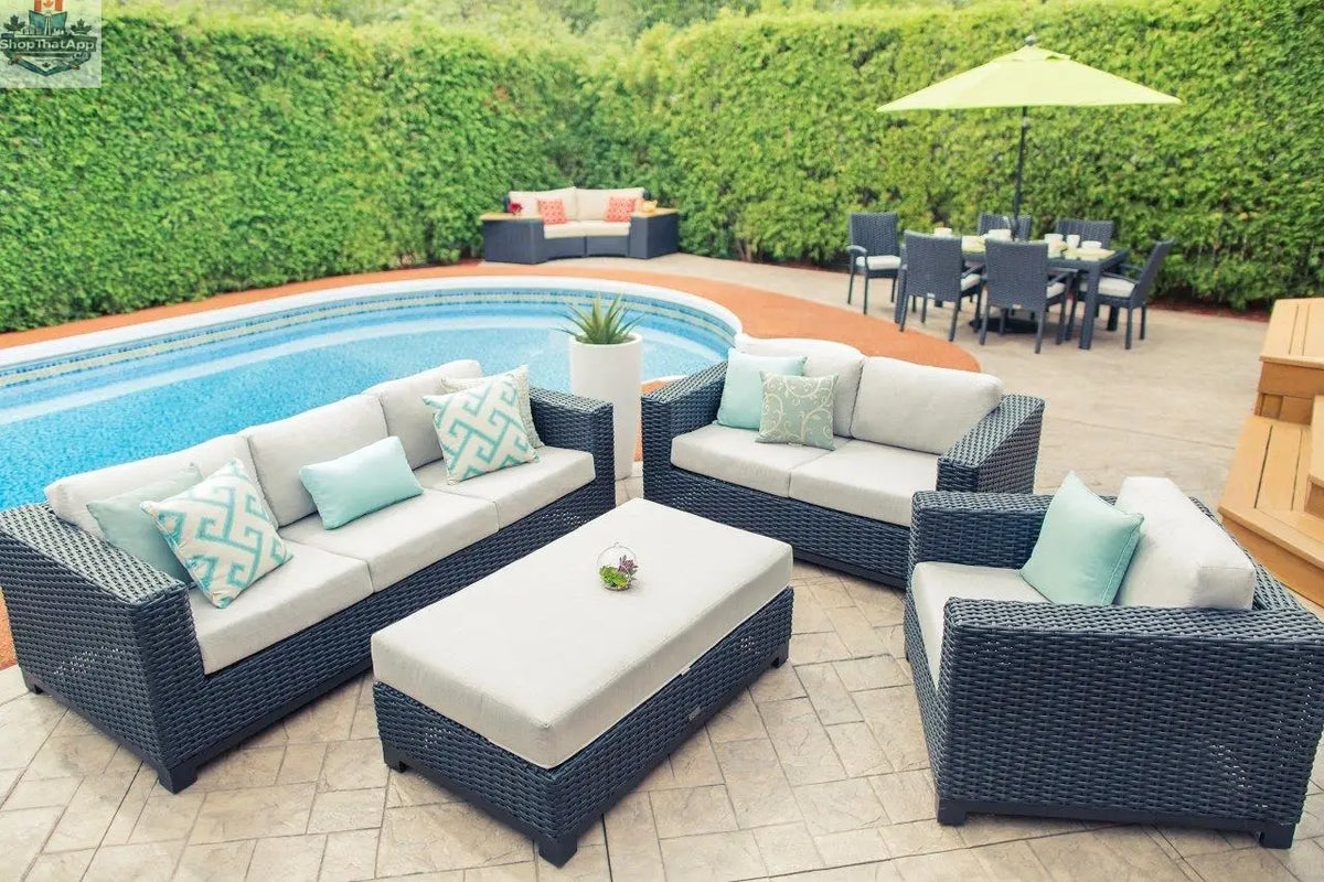 Enclover Trillium loveseat with Sunbrella cushions for stylish outdoor comfort, featuring a cozy side sofa and matching ottoman.