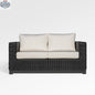 Enclover Trillium loveseat with Sunbrella cushions, showcasing stylish outdoor seating with comfortable, weather-resistant fabric.