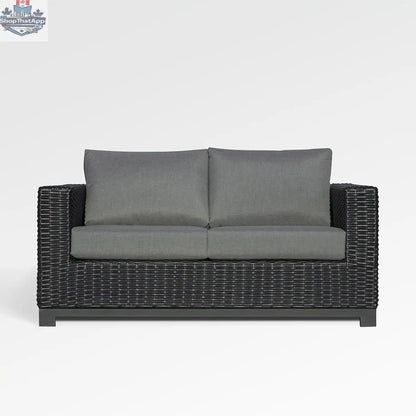 Enclover Trillium loveseat with Sunbrella cushions, stylish outdoor seating with a cozy, inviting design and vibrant fabric details.