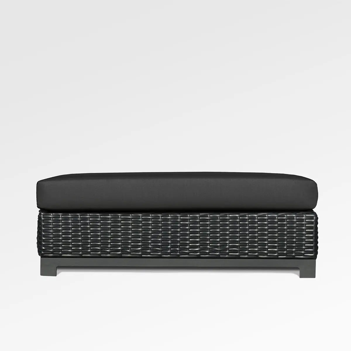 Enclover Trillium outdoor ottoman with Sunbrella Spectrum Carbon cushion, stylish and durable for outdoor seating and relaxation.