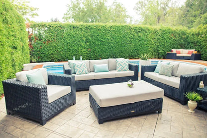 Enclover Trillium outdoor ottoman with Sunbrella cushion, stylish and durable for outdoor comfort, shown in a conversational setting