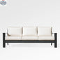 Magnolia black aluminum sofa set by Enclover with Sunbrella® cushions, featuring a contemporary design and bird-patterned fabric.