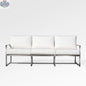 Enclover Acacia outdoor sofa with Sunbrella white canvas cushions, stylish and comfortable for outdoor lounging and relaxation.