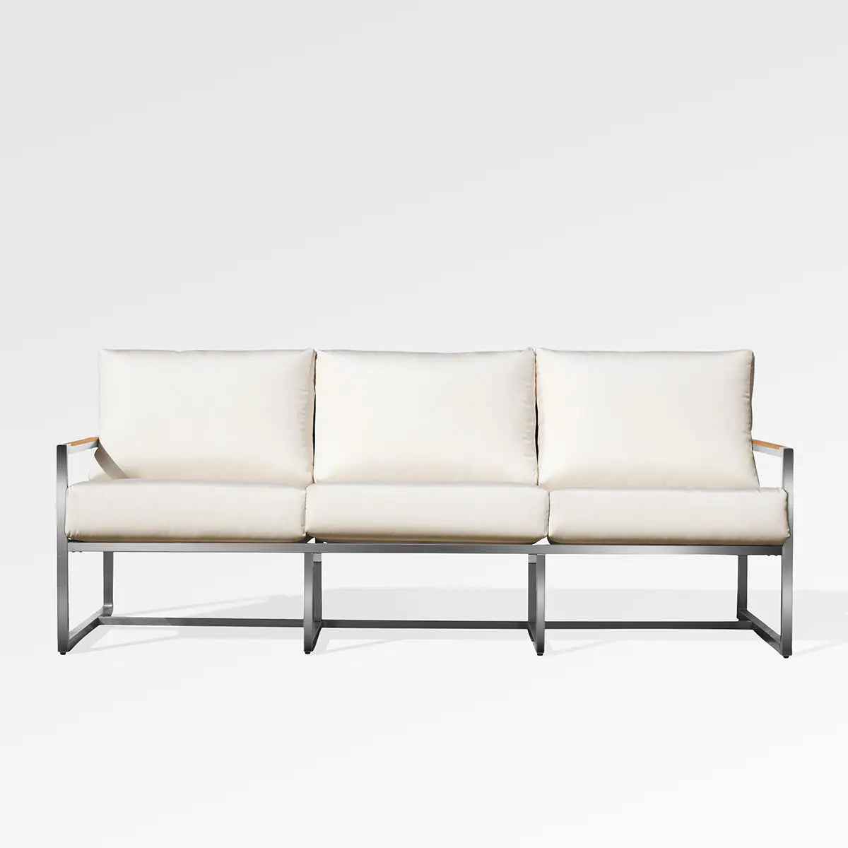 Enclover Acacia outdoor sofa with Sunbrella cushions, showcasing stylish design and comfortable seating for outdoor spaces.