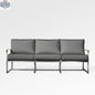 Enclover Acacia outdoor sofa with Sunbrella cushions, featuring a stylish cast slate finish and plush seating for outdoor comfort.