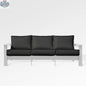 Enclover Hickory outdoor sofa with white Sunbrella cushion, stylish patio seating with comfortable cushions and modern design.