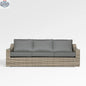 Enclover Tulip sofa with Sunbrella cushions, showcasing outdoor comfortable seating with stylish design and plush cushions.