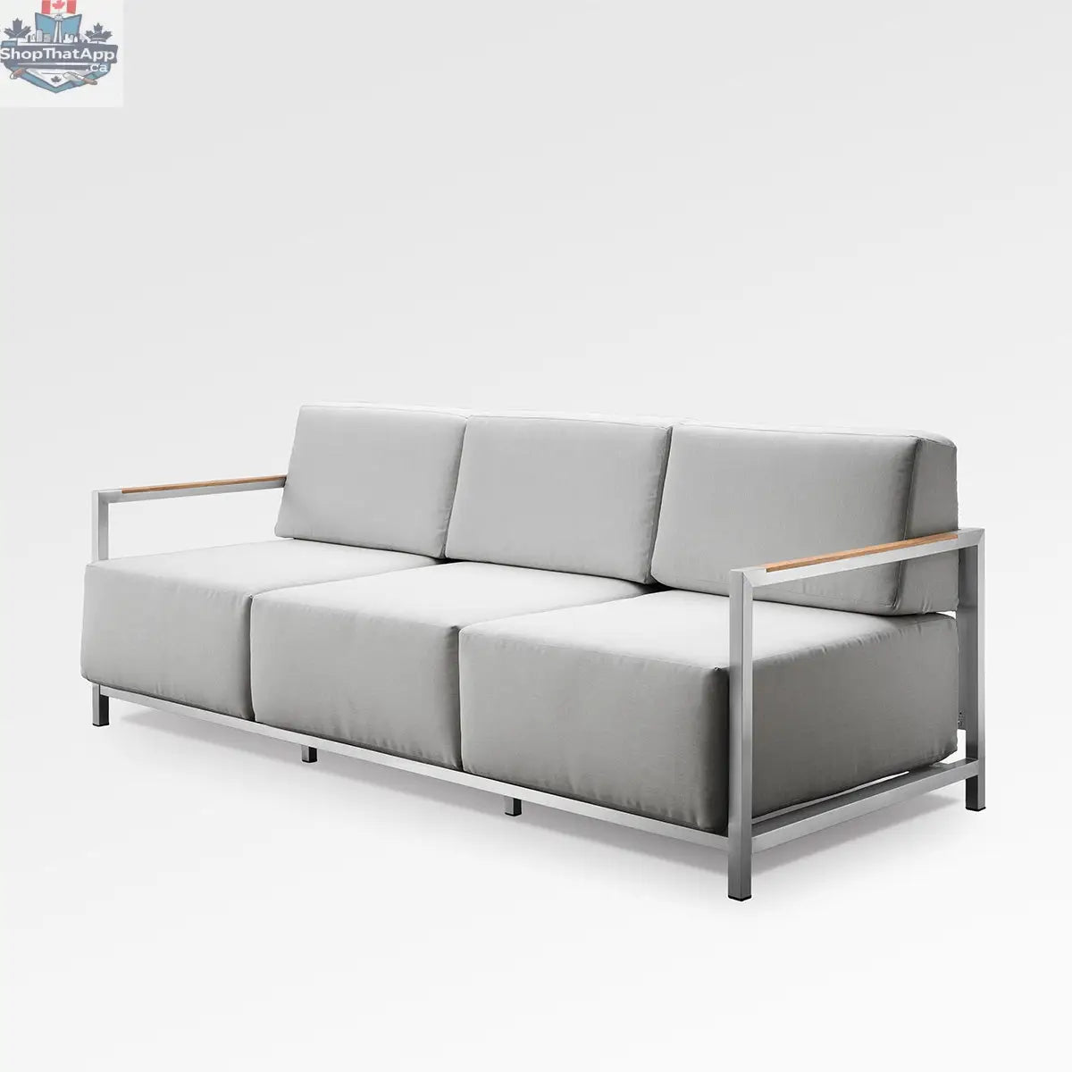 Enclover Acacia Lux sofa with sunbrella cushions, featuring a modern design and plush seating in a stylish living room setting.