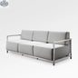 Enclover Acacia Lux sofa with sunbrella cushions, featuring a modern design and plush seating in a stylish living room setting.