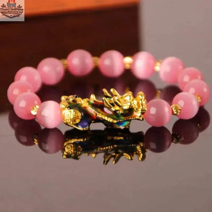 Gold plated PiXiu bracelet with crystal beads, stylish jewelry from EX-STOCK Canada featuring intricate design details.
