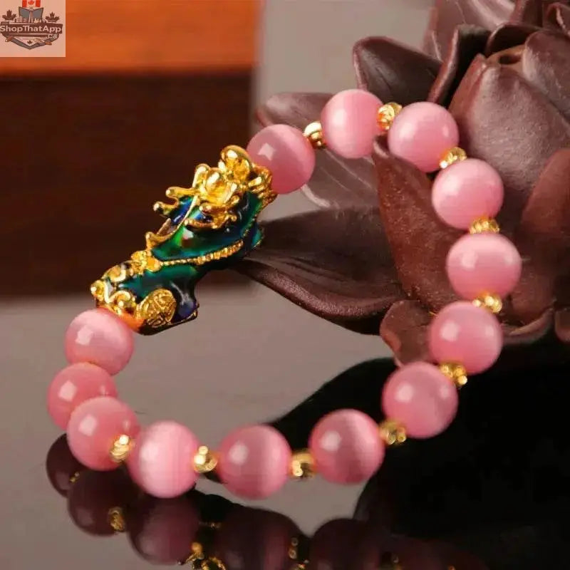 Gold plated PiXiu bracelet with crystal beads, stylish jewelry accessory from EX-STOCK Canada featuring intricate design.
