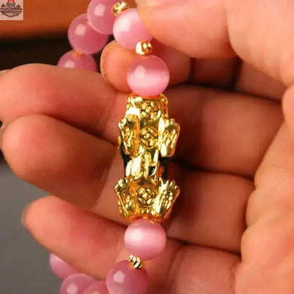 Gold plated PiXiu bracelet with 3D design and crystal beads, stylish accessory from EX-STOCK Canada.