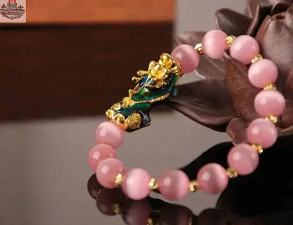 Gold plated PiXiu bracelet with crystal beads, featuring a 3D design and intricate craftsmanship from EX-STOCK Canada.