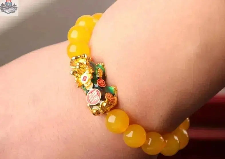 Gold plated PiXiu bracelet with crystal beads, featuring intricate 3D design and traditional Asian-inspired jewelry style.