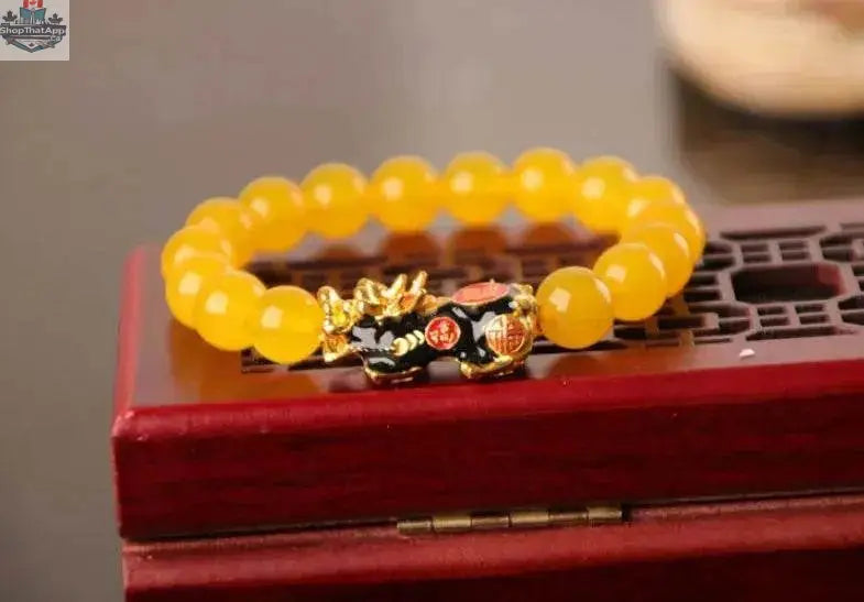 Gold plated PiXiu bracelet with crystal beaded design, featuring intricate craftsmanship and a vibrant, decorative style.