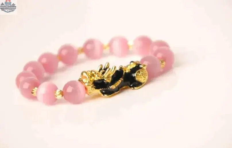 Gold plated PiXiu bracelet with crystal beads, featuring intricate 3D design, stylish accessory from EX-STOCK Canada.