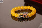 Gold plated PiXiu bracelet with crystal beads, featuring intricate 3D design and Asian-inspired jewelry style.