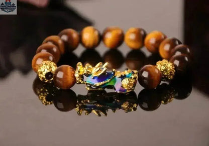 Gold plated PiXiu bracelet with crystal beaded design, featuring intricate craftsmanship and traditional Chinese motifs.