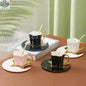Creative ceramic coffee cup set with star and moon saucers, featuring four uniquely designed cups by EX-STOCK Canada.