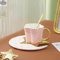 Set of four ceramic coffee cups with star and moon saucers, featuring creative celestial designs by EX-STOCK Canada.