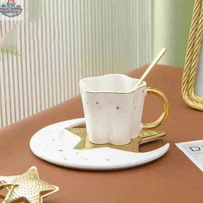 Set of four creative ceramic coffee cups with star and moon saucers, featuring celestial designs, by EX-STOCK Canada.