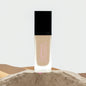 Vegan hydrating foundation FencyGrace Miriam 101, high-end makeup product for luminous skin, in a sleek tube with a pump.
