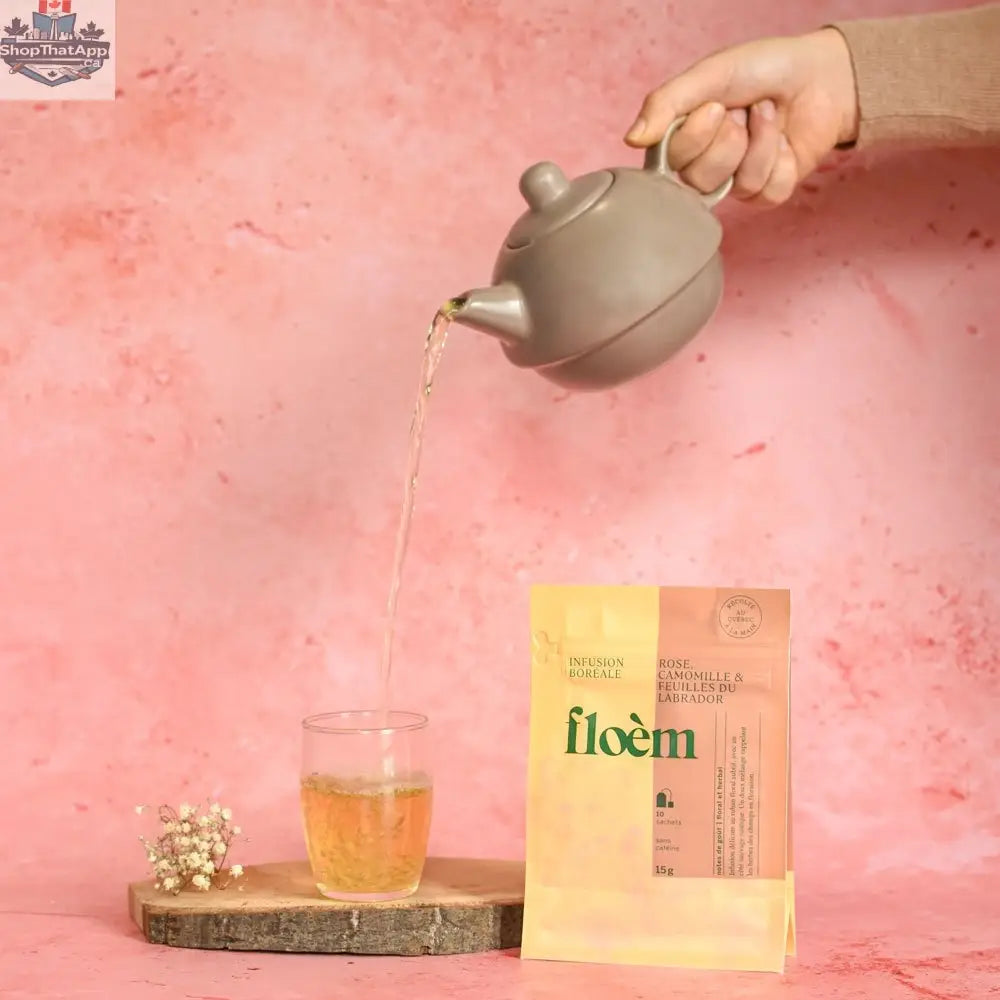 Floèm Tisane Rose Camomille en sachets with dried rose petals, chamomile flowers, and Labrador leaves for relaxation and wellness.