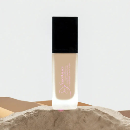 Vegan hydrating foundation by FencyGrace in shade Lea, high-end beauty makeup product with smooth liquid texture.