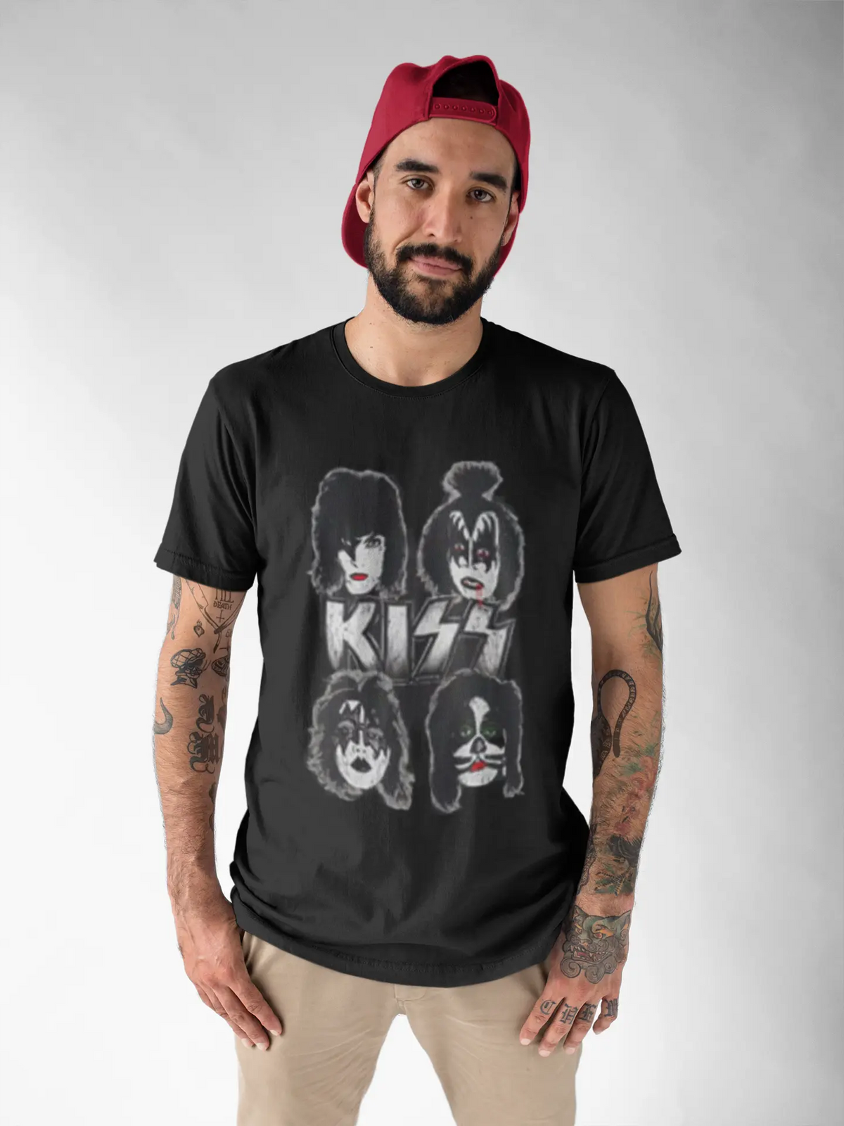 Front view of a middle-aged man wearing a black KISS Dynasty Cover T-Shirt by Little Guitars, featuring a round neckline and graphic design.