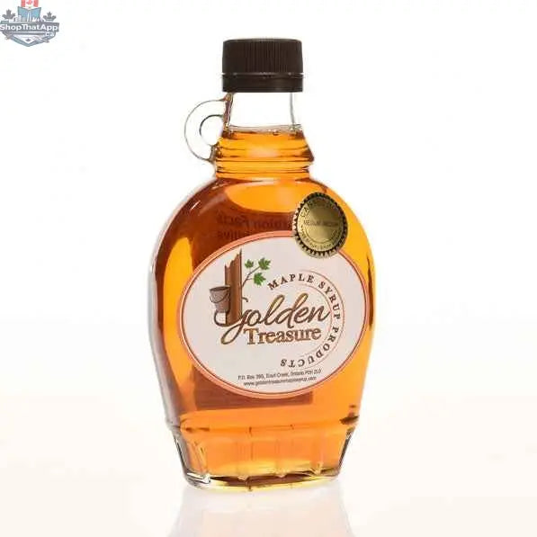 Glass bottles of Golden Treasure Maple Syrup, organic maple syrup in clear glass containers with golden caps.