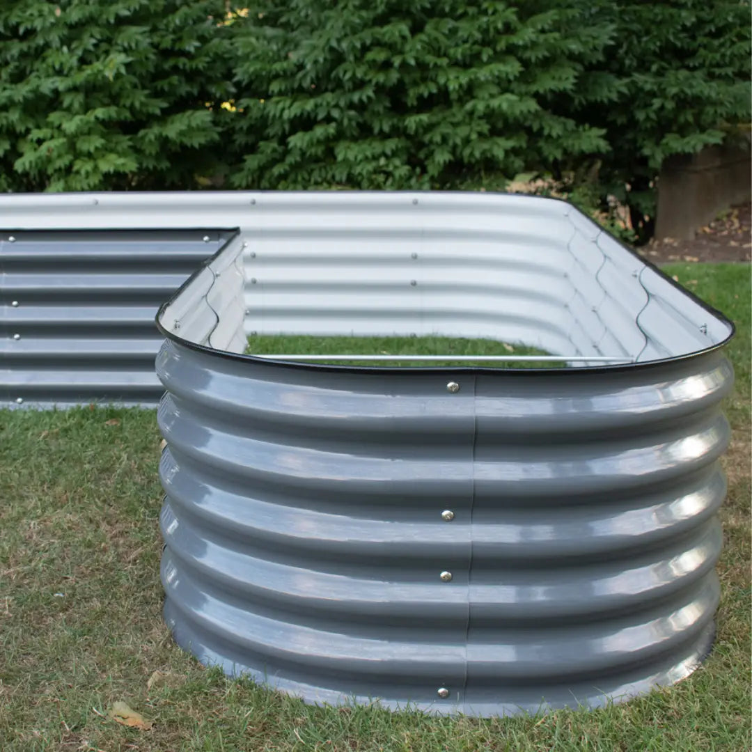 Modular green garden bed kit by Green Experience, 17-inch tall L-shape garden bed for balconies and small outdoor spaces.