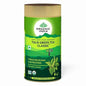Organic India Tulsi Green Tea in a classic tin, premium organic tulsi leaves for wellness, displayed in a natural setting.