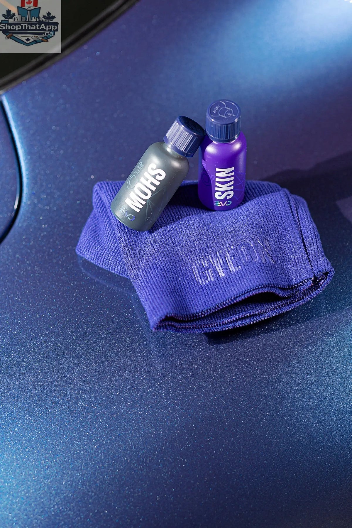 GYEON Q² Syncro EVO Lightbox showcasing the ceramic coating application on a car surface with branding and equipment.