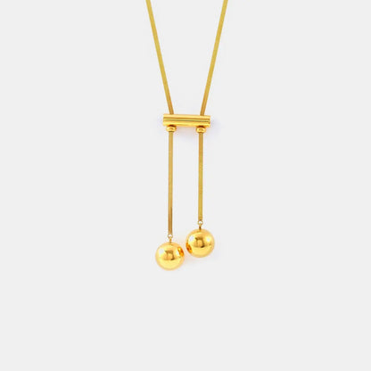 18K gold-plated titanium necklace with hollow bead design, featuring sleek and modern jewelry from harry'zBOUTIQUE.
