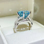 Sterling silver 10 carat moissanite ring with a sparkling central gemstone, featuring a sleek and elegant design.