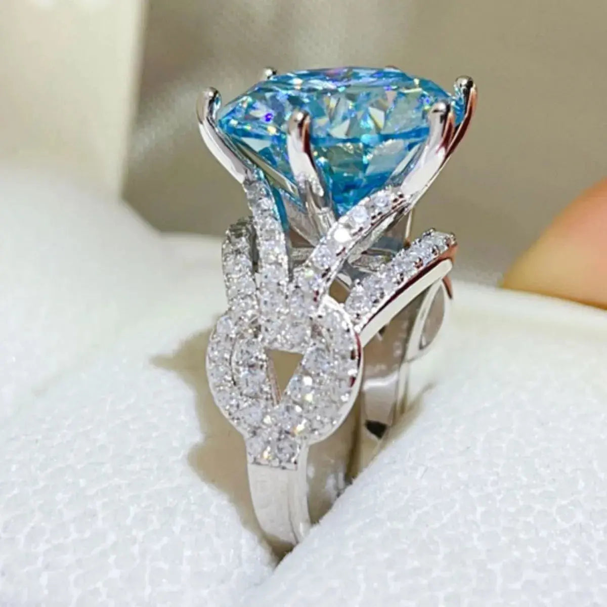 Sterling silver 10 carat moissanite ring with a sparkling central gemstone, crafted by harry'zBOUTIQUE.