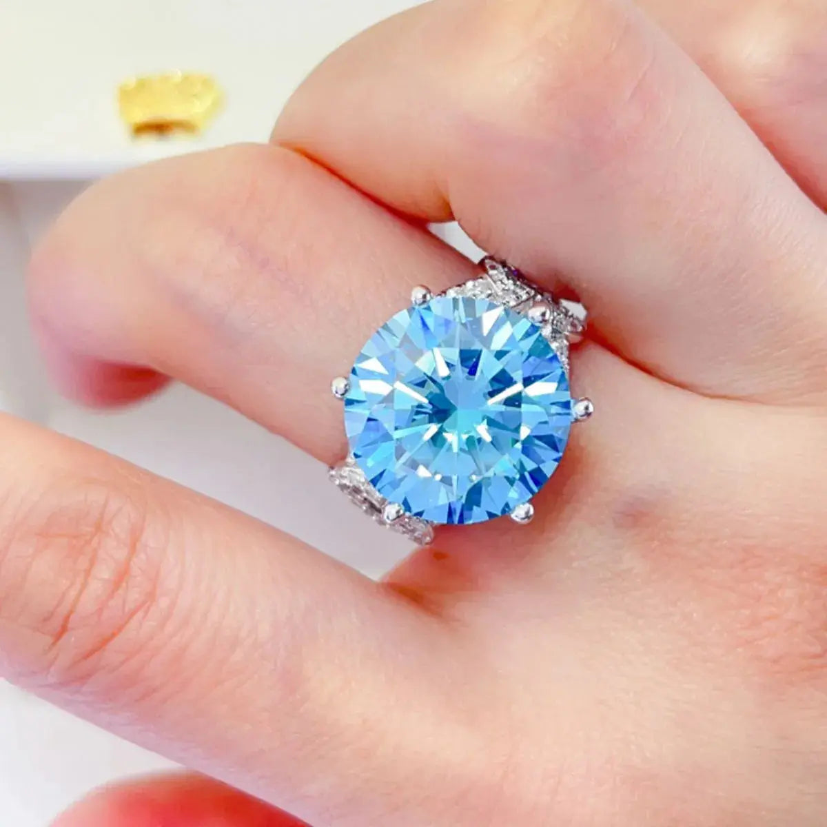 Sterling silver 10 carat moissanite ring with a sparkling central stone, elegant design, by harry'zBOUTIQUE.