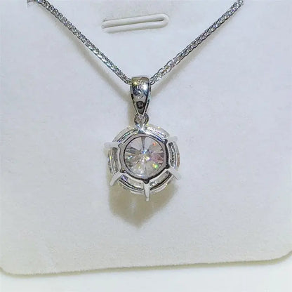 Sterling silver 10 carat moissanite necklace with pendant, showcasing sparkling gemstone and elegant chain design.