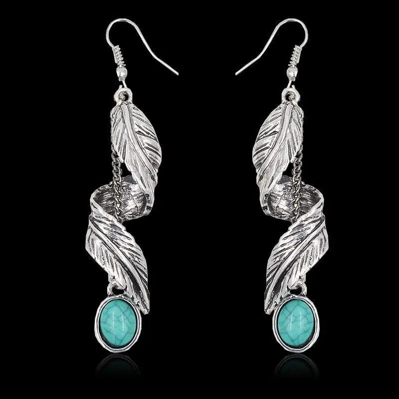 Turquoise alloy leaf earrings with stylish, elegant design, featuring detailed leaf shapes and a vibrant turquoise finish.