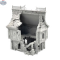 Detailed image of a ruined house terrain piece from Hawk Collectibles' Wargaming Terrain series, depicting a damaged building in misty hollow setting.