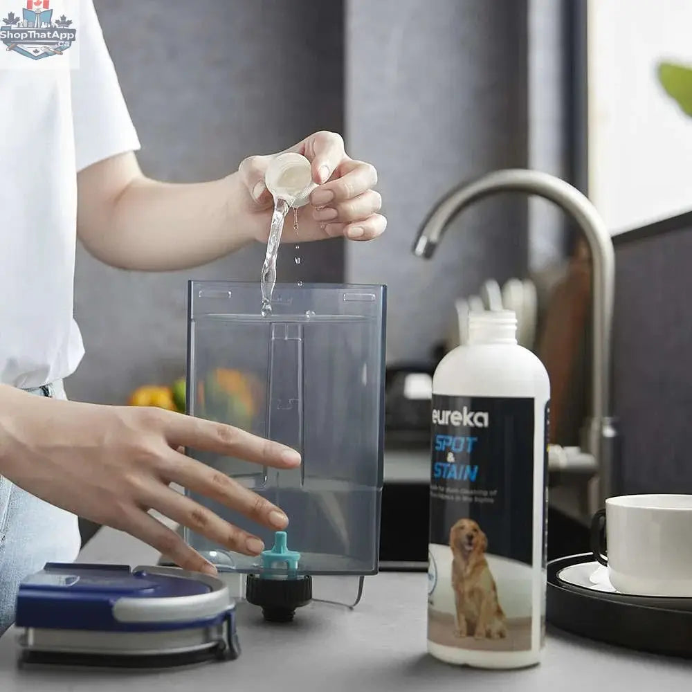 Portable Eureka NEY100 carpet cleaner from Home Essentials Outlet, showing the compact design and cleaning attachments.