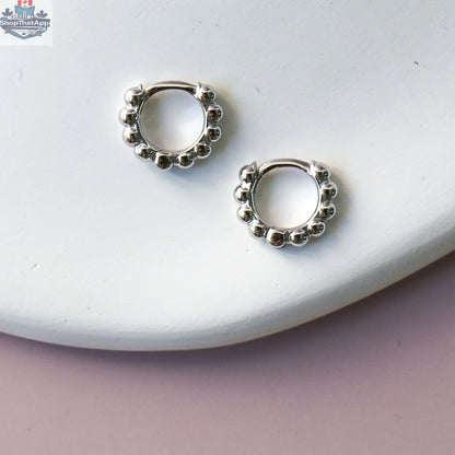 Gold hoop earrings from HoraceJewelry with intricate detailing, perfect for elegant and stylish accessories.