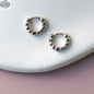 Gold hoop earrings from HoraceJewelry with intricate detailing, perfect for elegant and stylish accessories.