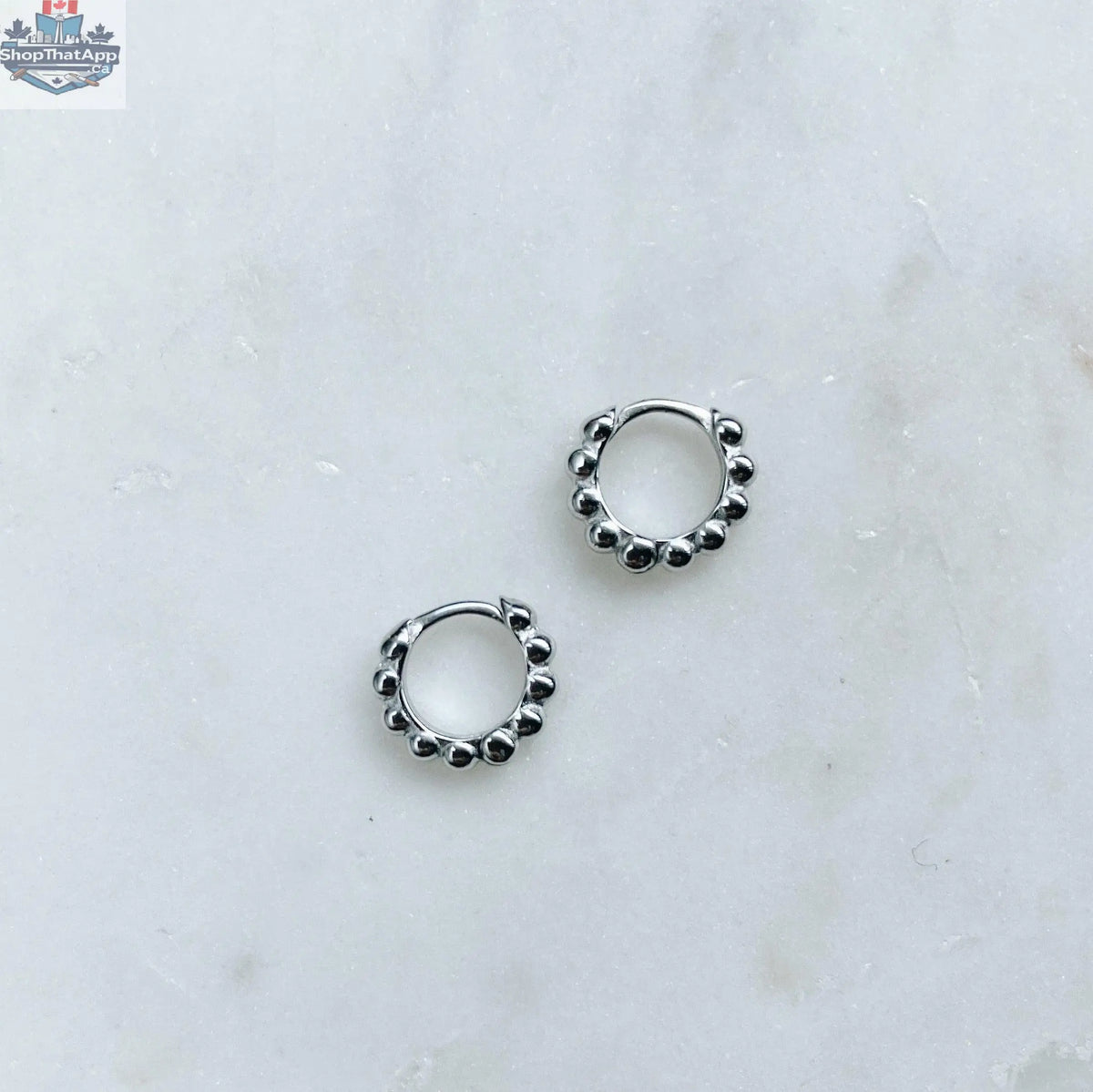 Elegant silver hoop earrings by HoraceJewelry, showcasing smooth polished surfaces and classic style for versatile wear.