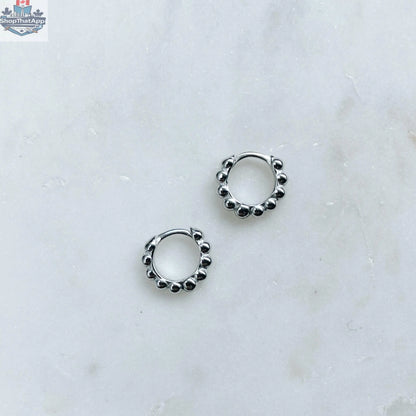 Elegant silver hoop earrings by HoraceJewelry, showcasing smooth polished surfaces and classic style for versatile wear.