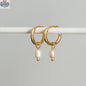 HoraceJewelry Dolko Shoes stylish earrings with boucle design, showcasing elegant gold-tone hoops and intricate detailing.