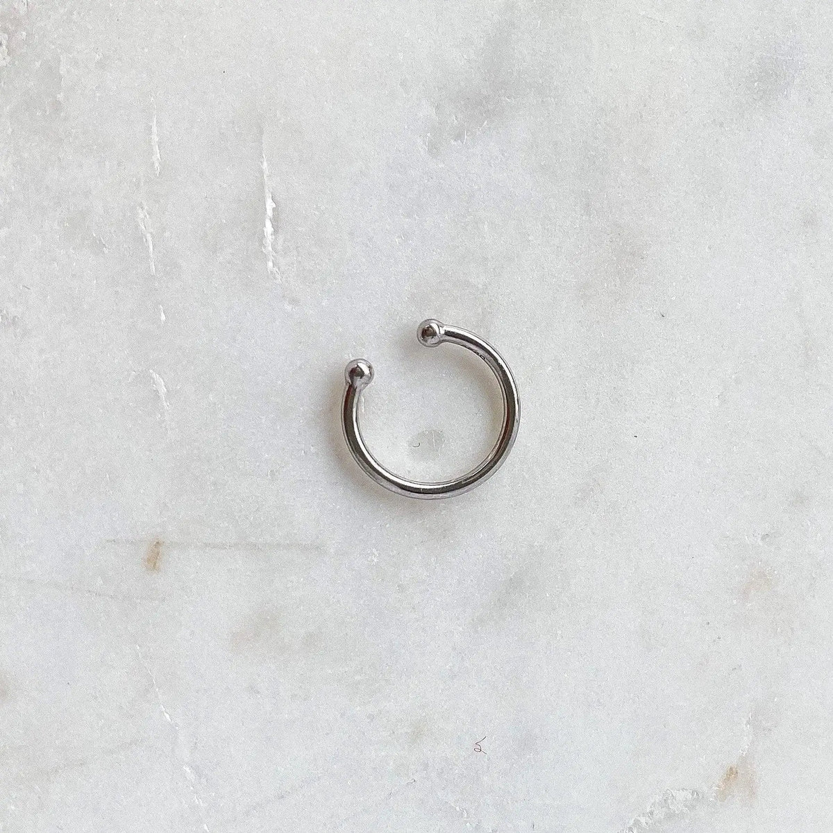 Silver ear cuff by HoraceJewelry, showcasing a sleek, minimalist design for effortless style and chic elegance.